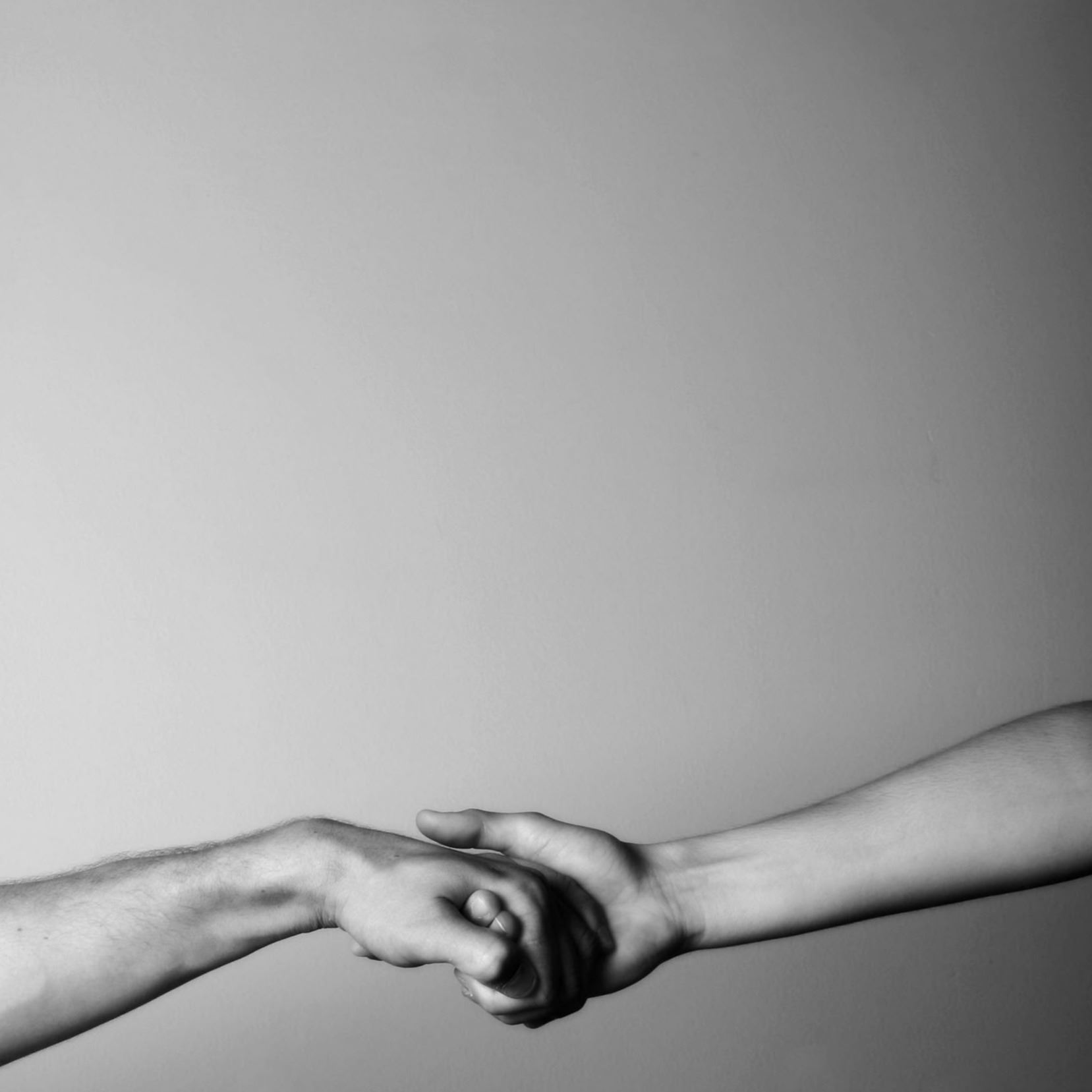 Hands holding each other for help